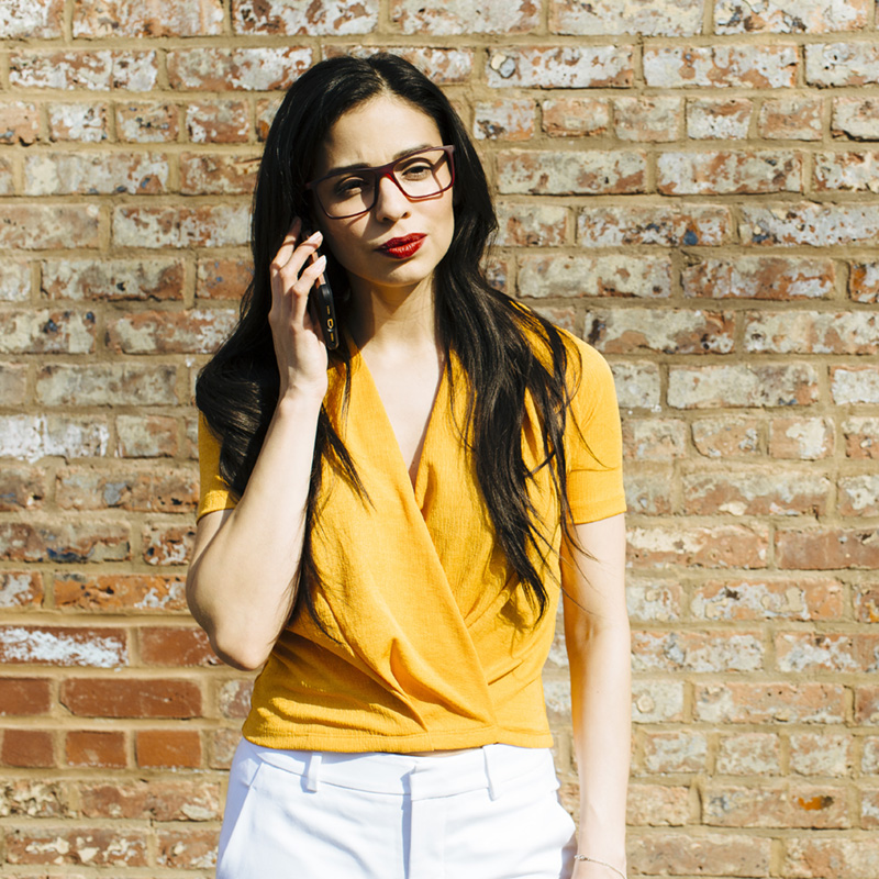 woman speaking on a mobile phone looking serious